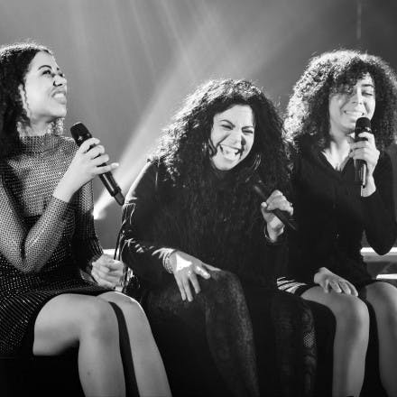 Chaka sat on the edge of the stage laughing with her two backing vocalists.